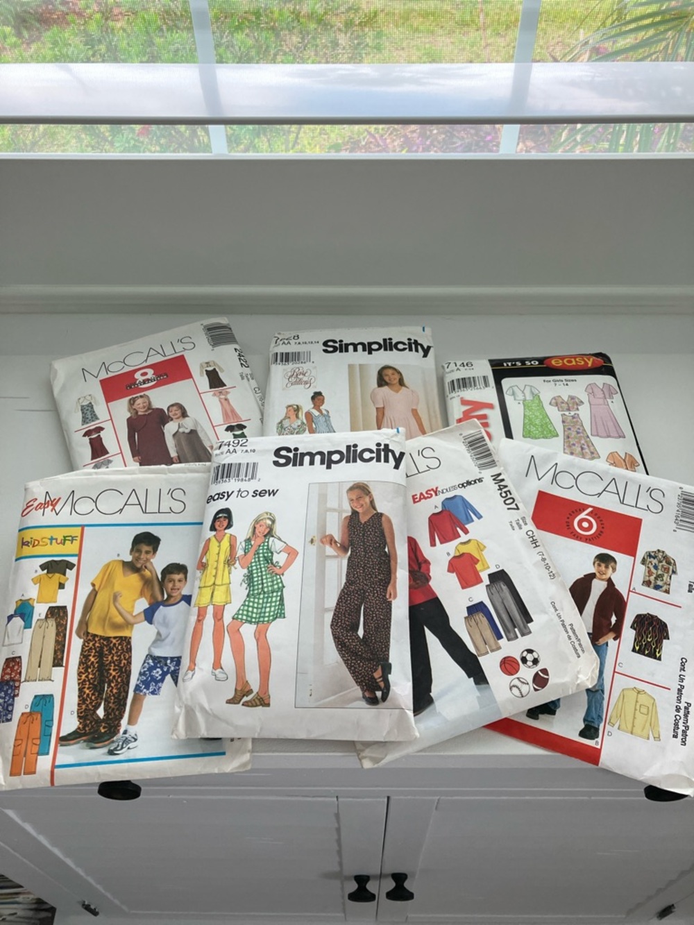 Seven children’s sewing patterns size is 7–14
